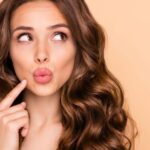 girl thinking looking aside pouted lips