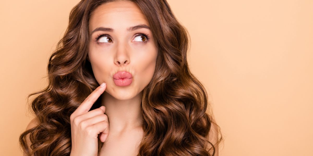 girl thinking looking aside pouted lips
